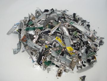 A pile of shredded hard drive pieces